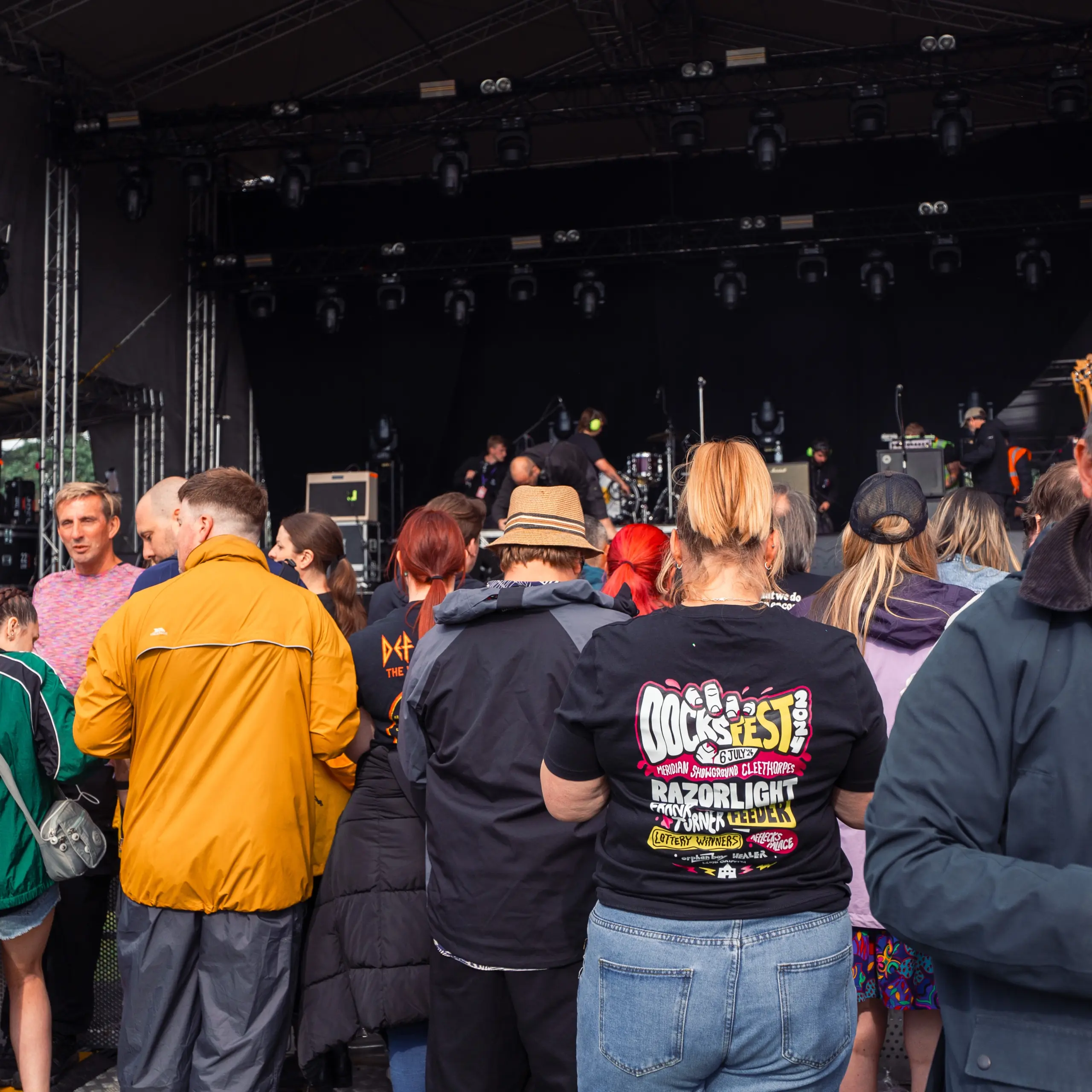 Docks Fest 2024 crowd photograph showing woman wearing a branded Docks Fest T Shirt designed and printed by Sourcefour