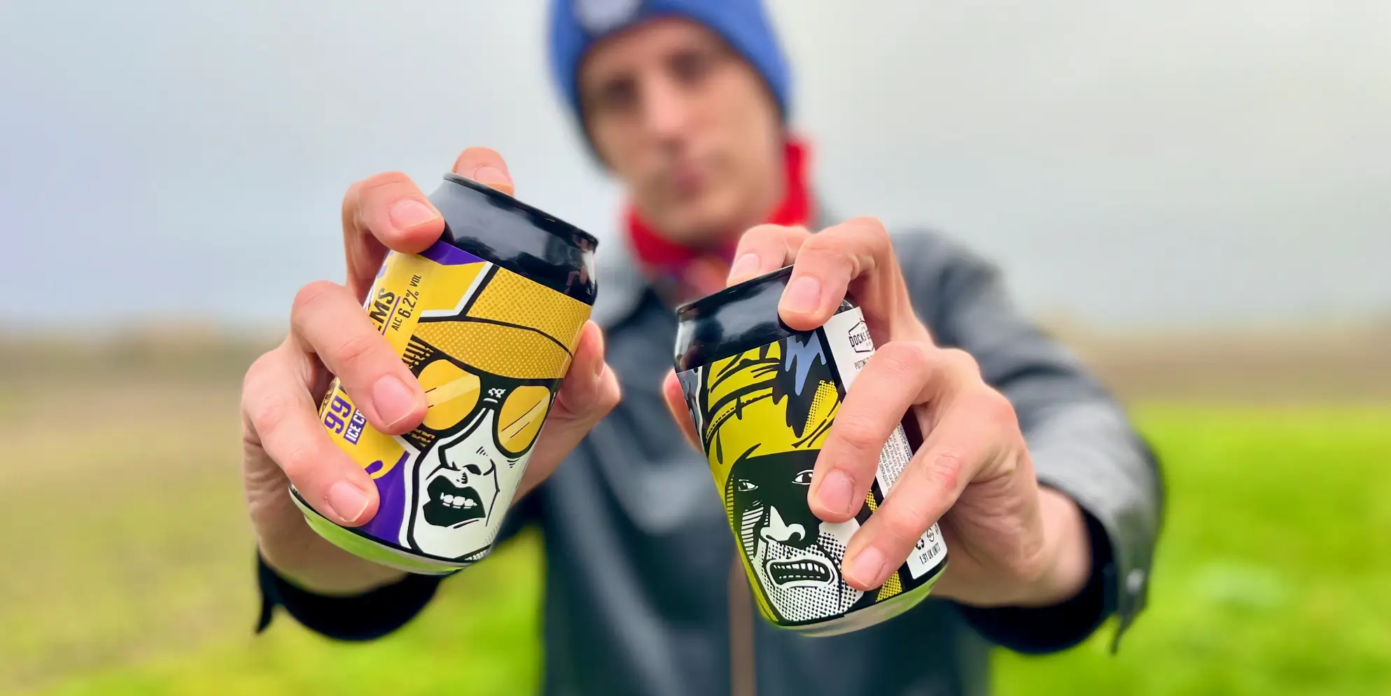 Sourcefour designer Kirk holding both Docks Beers x Beer52 craft beer cans