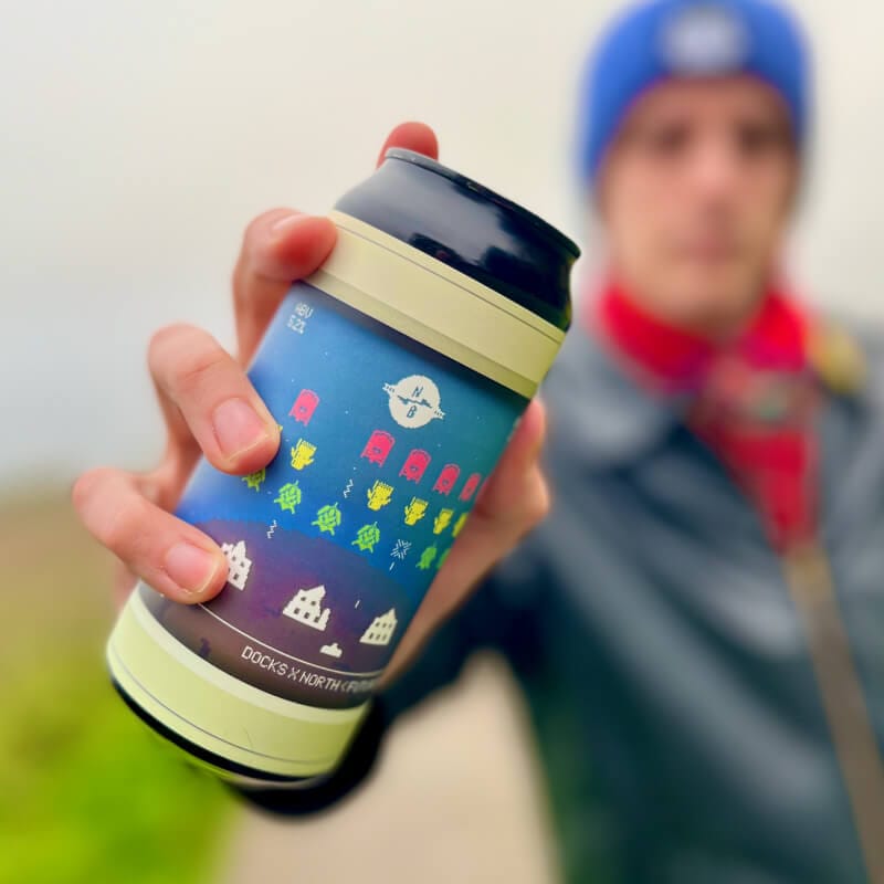 Sourcefour designer Kirk holding 440ml can of Docks Beers x North Brewing Co collab FUTUREPROOF